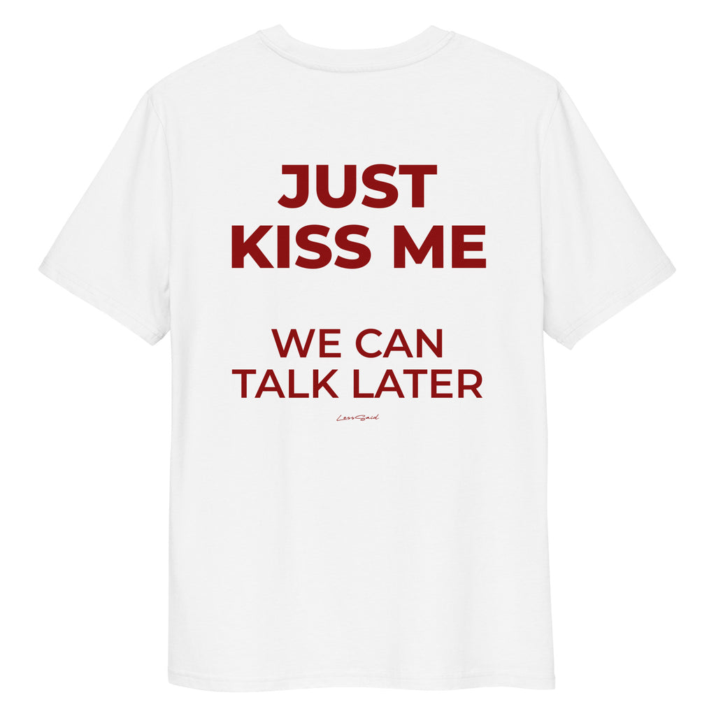 Unisex white organic cotton T-shirt from LessSaid with "Just Kiss Me" graphic on the back, casual and comfortable style.