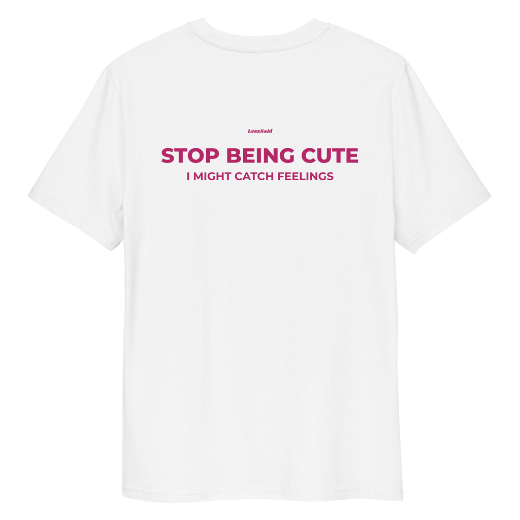 Unisex white organic cotton T-shirt with "Stop Being Cute" print from LessSaid, showing the back view.