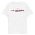 White unisex organic cotton T-shirt with "STOP FOLLOWING ME" printed on the back by LessSaid.