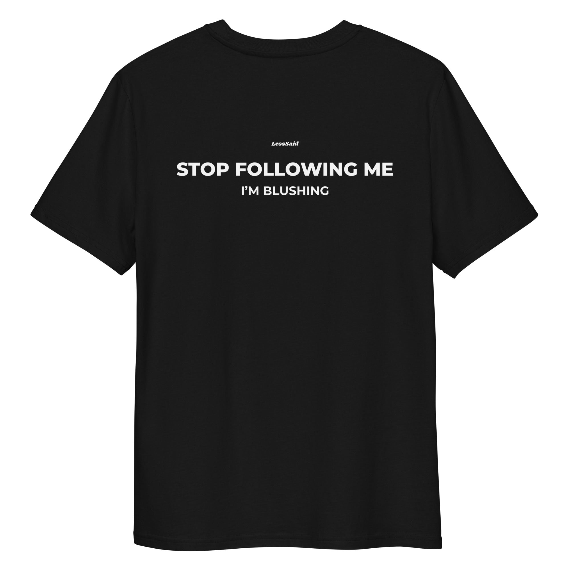 Unisex black organic cotton T-shirt with "STOP FOLLOWING ME" graphic, from LessSaid, shown from the back.
