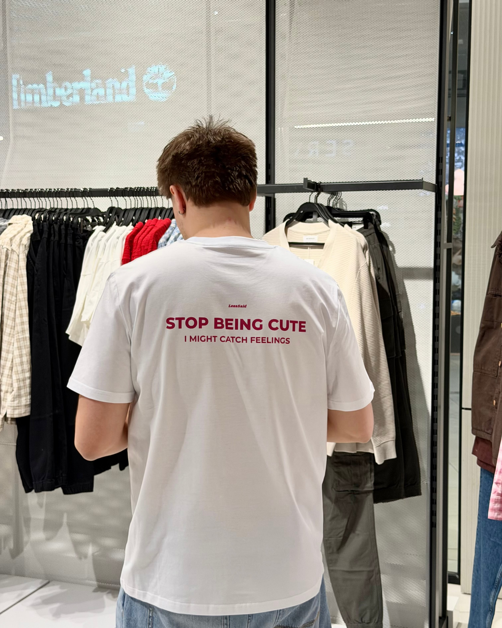 LessSaid "Stop Being Cute" graphic T-shirt featuring bold text on a comfortable cotton fabric.